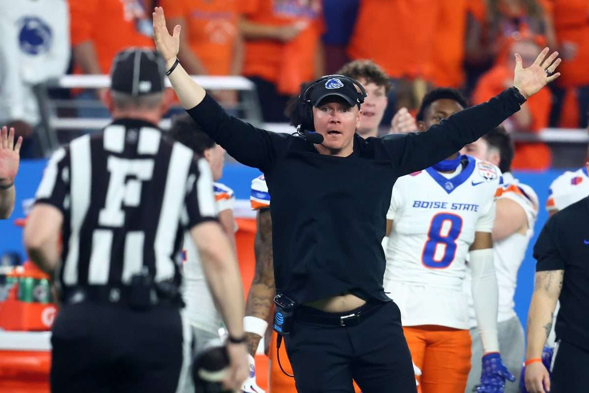 Dec 31, 2024; Glendale, AZ, USA; Boise State Broncos head coach Spencer Danielson reacts toward the referee against the Penn State Nittany Lions during the first half in the Fiesta Bowl at State Farm Stadium. Mandatory Credit: Mark J. Rebilas-Imagn Images