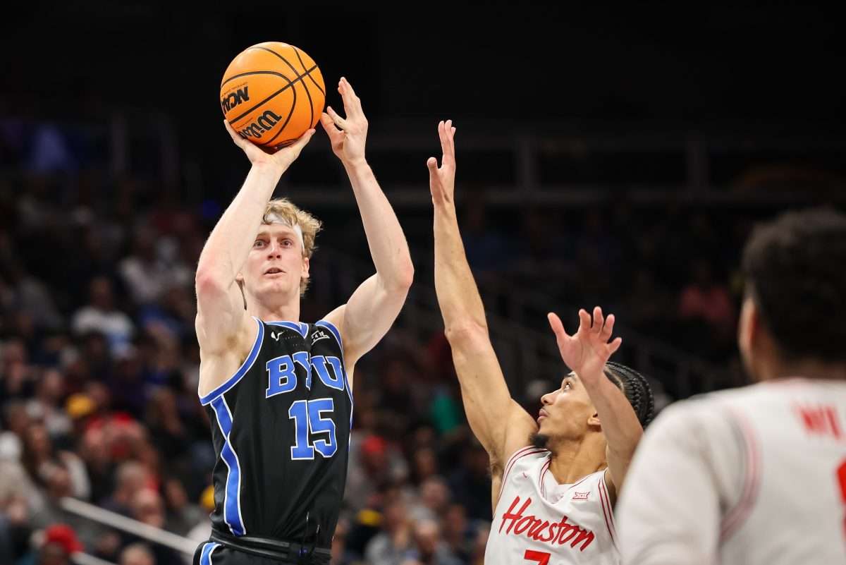 Mar 14, 2025; Kansas City, MO, USA; Brigham Young Cougars forward Richie Saunders (15) shoots the ball during the second half against the Houston Cougars at T-Mobile Center. Mandatory Credit: William Purnell-Imagn Images